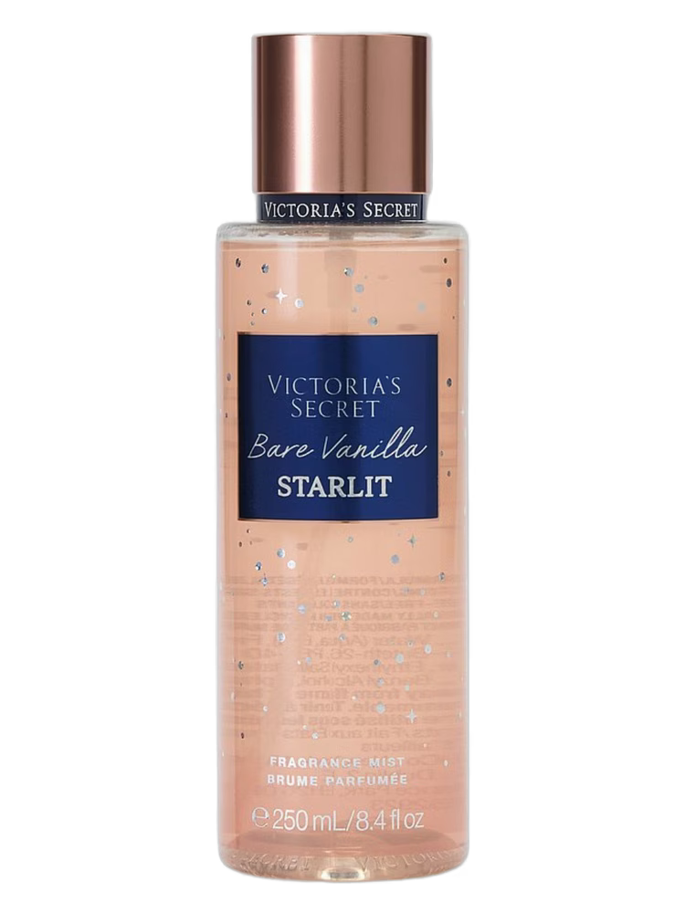 Frasco transparente de perfume corporal bare vanilla starlit victoria’s secret com tampa rose gold e líquido pêssego brilhante