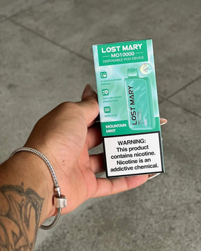 Dispositivo descartável lost mary mo10000 verde menta com embalagem, design retangular e indicação de sabor