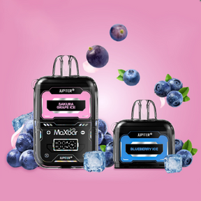 Máquina de gelo black jupiter maxxa com display rosa e azul rodeada de mirtilos e cubos de gelo modelo maxbar jupiter 20k com 1 cartucho extra