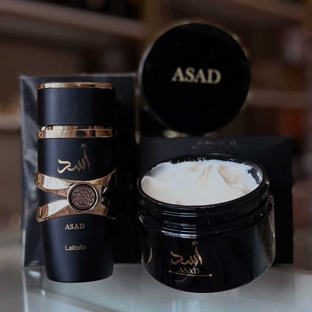 Perfume black asad lattafa com detalhes dourados e pote preto com creme branco pasta hidratante asad isabelle la belle
